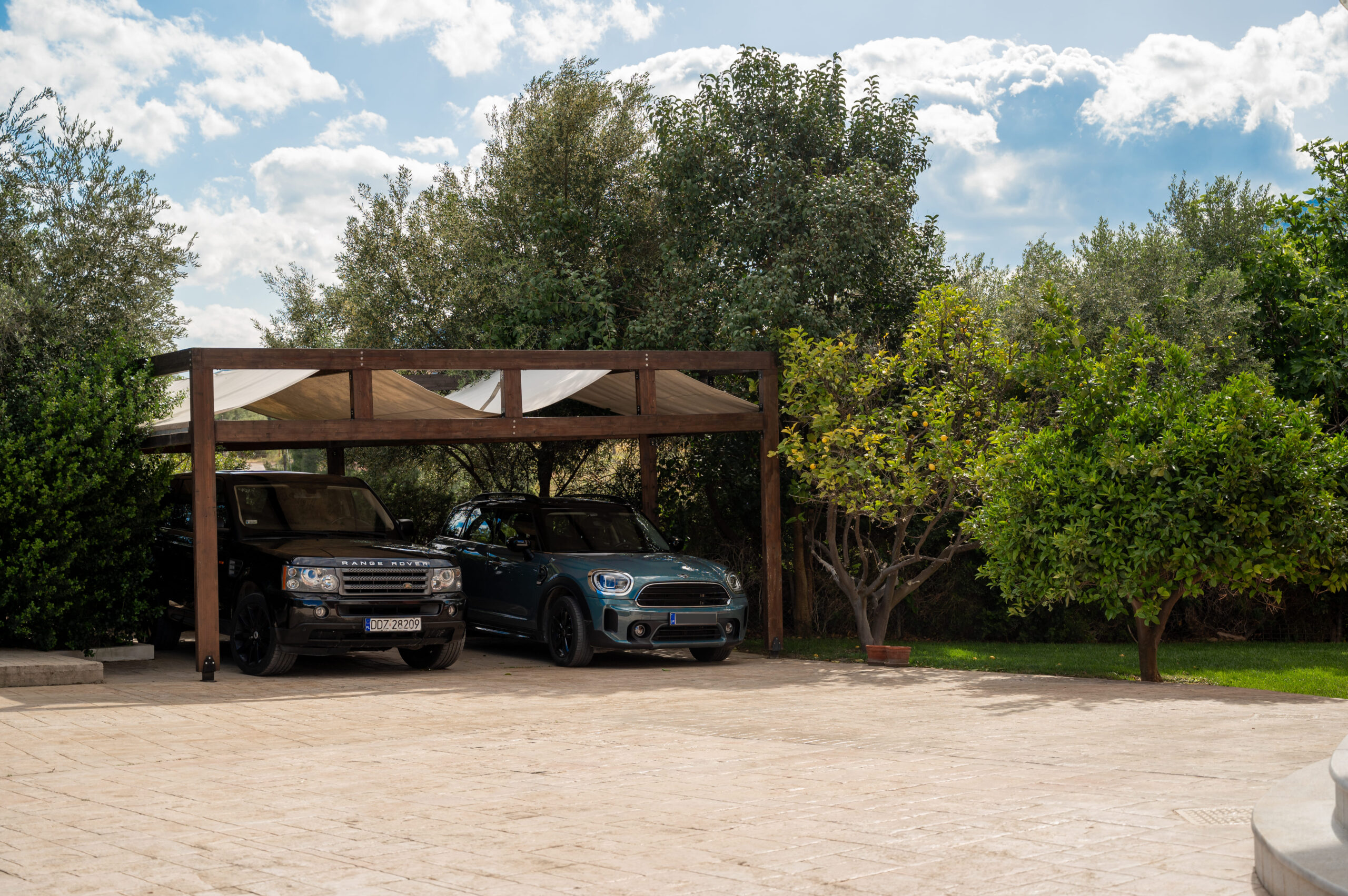 Covered parking area surrounded by trees