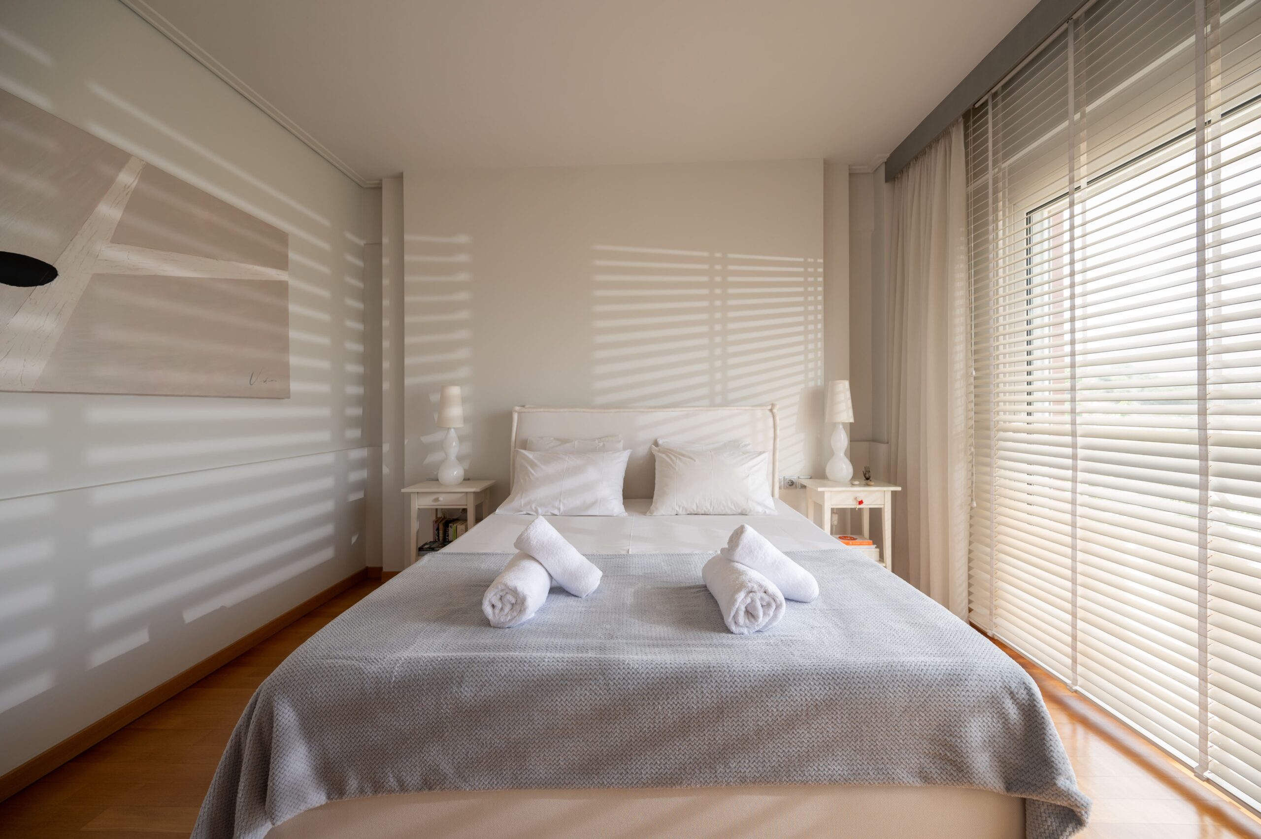 Bright bedroom with king-size bed and modern decor