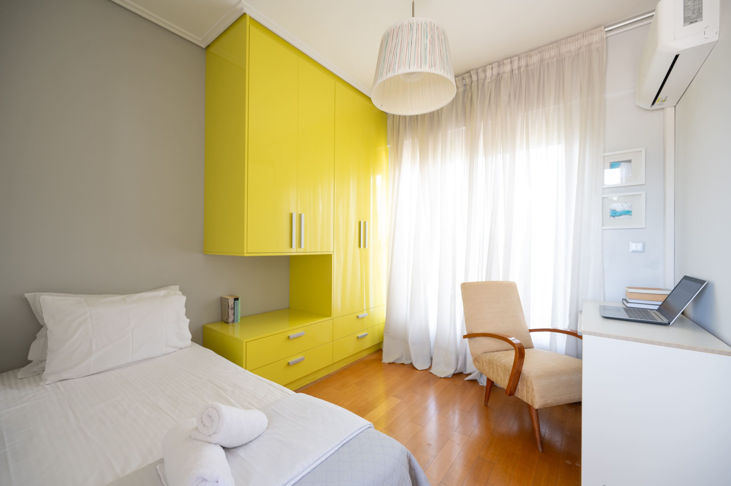 Stylish guest bedroom with minimalist furniture